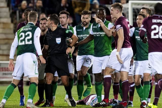 Tempers flared following the challenge by Hibs' Florian Kamberi on Hearts' Oliver Bozanic. Picture: Craig Williamson/SNS