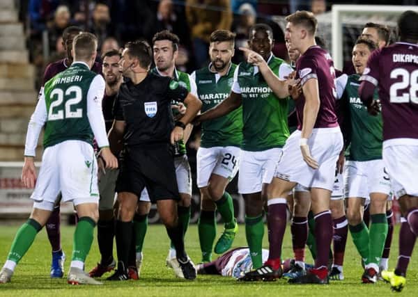 Tempers flared following the challenge by Hibs' Florian Kamberi on Hearts' Oliver Bozanic. Picture: Craig Williamson/SNS