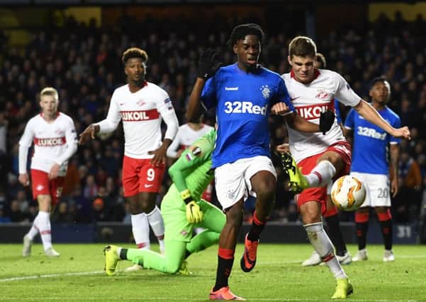 Rangers midfielder Ovie Ejaria, left, tussles with Spartak Moscow's Roman Zobnin during the 0-0 draw at Ibrox. Picture: SNS
