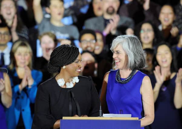 Congresswomen Ayanna Pressley (L) and Katherine Clark introduce Senator Elizabeth Warren (out of frame) at the audience during the Election Day Massachusetts Democratic Coordinated Campaign Election Night Celebration at the Fairmont Copley Hotel in Boston, Massachusetts