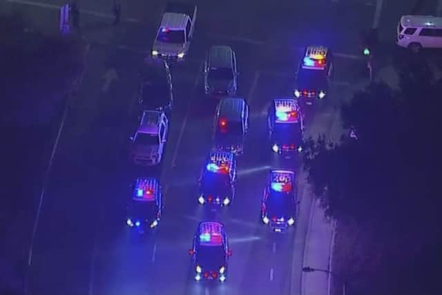 Police vehicles block an intersection in the vicinity of a shooting in Thousand Oaks, California, early Thursday, Nov. 8, 2018.  Authorities say there were multiple injuries after a man opened fire in Southern California bar late Wednesday. (KABC via AP)