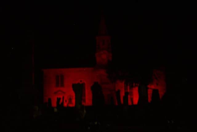 Duns Parish Church is floodlit in red as part of Poppy Scotland's national network of 'Light Up Red' locations.