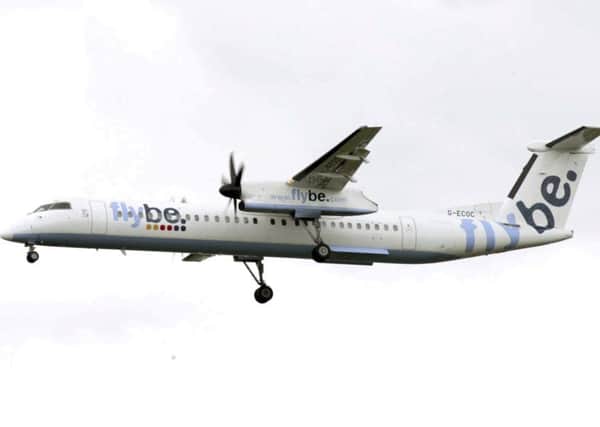 A Bombardier Dash 8 turboprop Flybe aircraft. See SWNS story SWPLflybe; Flybe flight plunged 500ft to the ground after autopilot was accidentally set to zero. Picture; SWNS