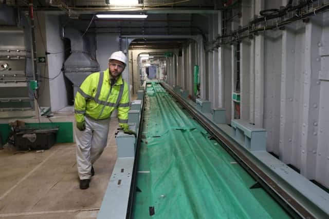 Stewart Sykes from Aircraft carrier Alliance views the forward weapons preparation area during a tour of the under-construction aircraft carrier, HMS Prince of Wales, at BAE Systems in Rosyth, Fife. Picture: Andrew Milligan/PA Wire