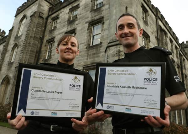 Police Constables Laura Sayer and Kenneth MacKenzie. Picture: Andrew Milligan/PA Wire