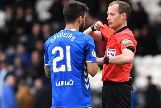 Willie Collum shows Candeias the red card for picking up two bookings. Picture: SNS Group