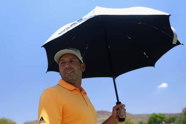 Sergio Garcia takes shetler from the midday sun during the third round of the Nedbank Golf Challenge. Pic: Warren Little/Getty Images
