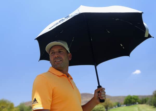 Sergio Garcia takes shetler from the midday sun during the third round of the Nedbank Golf Challenge. Pic: Warren Little/Getty Images
