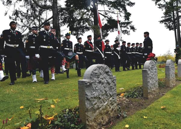 The centenary service at St Symphorien cemetery in Mons, Belgium. The cemetery contains the graves of the first and last British soldiers killed in the conflict. Picture: Geert Vanden Wijngaert/PA