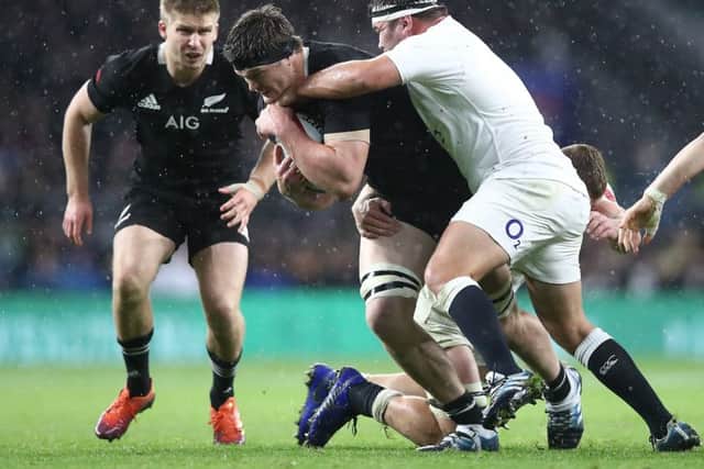 Scott Barrett of the All Blacks is tackled. Pic: Phil Walter/Getty Images
