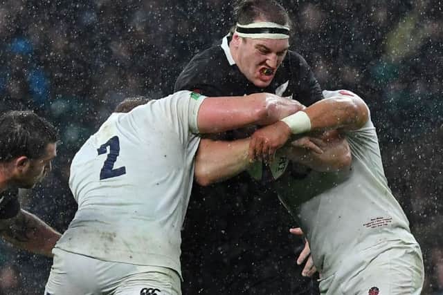 New Zealand lock Brodie Retallick is stopped in his tracks by England at Twickenham. Picture: Ben Stansall/AFP/Getty Images