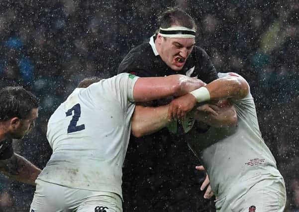 New Zealand lock Brodie Retallick is stopped in his tracks by England at Twickenham. Picture: Ben Stansall/AFP/Getty Images