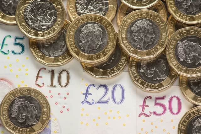 Nearly half a million people are earning less than the living wage in Scotland, according to a report. Picture: PA Wire