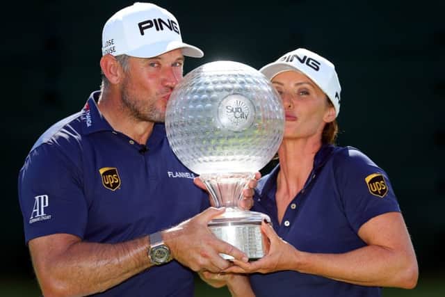 Lee Westwood with partner and caddie Helen Storey after winning the Nedbank Golf Challenge. Picture: Warren Little/Getty Images