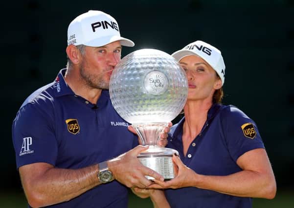 Lee Westwood with partner and caddie Helen Storey after winning the Nedbank Golf Challenge. Picture: Warren Little/Getty Images