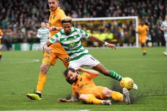 Keaghan Jacobs thunders into win the ball from Scott Sinclair. The long-serving Livingston midfielder was a stand-out for Gary Holt's side. Picture: SNS Group