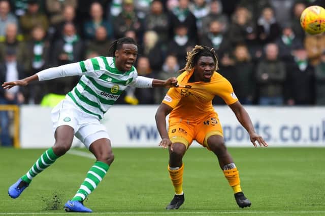 Dolly Menga tussles with Dedryck Boyata - but should the Livingston man have been sent off? Picture: SNS Group
