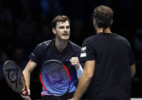 Jamie Murray celebrates winning a point with partner Bruno Soares on the way to victory at the O2 Arena in London. Picture: Getty Images