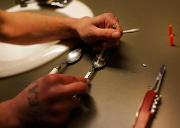 Drugs are prepared to shoot intravenously by a user addicted to heroin. Picture: Spencer Platt/Getty Images
