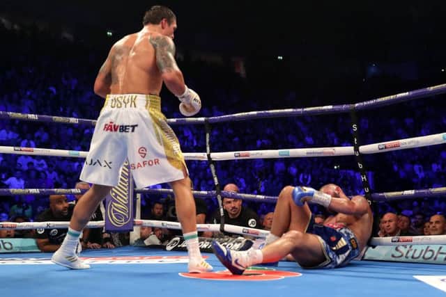 Oleksandr Usyk of Ukraine stands over Tony Bellew. Picture: Richard Heathcote/Getty Images