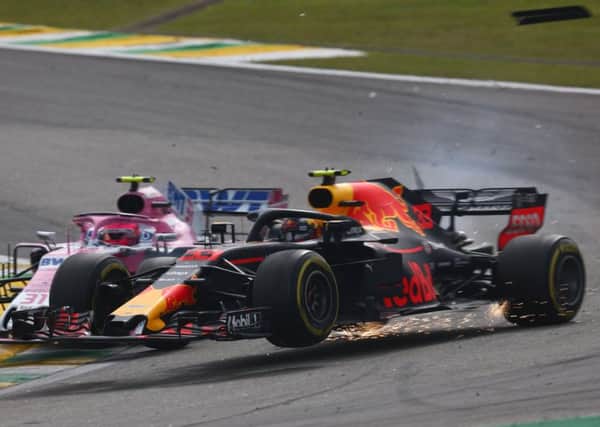 Max Verstappen (33) is crashed into by Esteban Ocon (31) in Brazil. Picture: Lars Baron/Getty Images