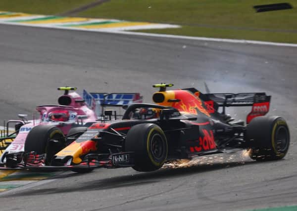 Max Verstappen (33) is crashed into by Esteban Ocon (31) in Brazil.  Picture: Lars Baron/Getty Images