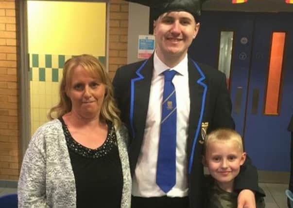 Cayden Mcauley (right) with his mother Lyndsey Baxter and brother Scott. Cayden, who helped save his mother's life after she collapsed unconscious, is calling for first aid to be taught in all state primary schools. Picture; PA