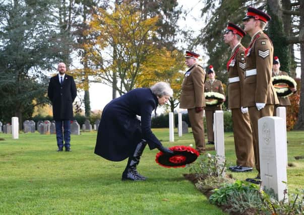 Theresa May laid a wreath at a military cemetery in MonsÃ¿ on Friday, but stayed in the UK for Armistice DayÃ¿ (Picture: Gareth Fuller/WPA Pool/Getty Images)