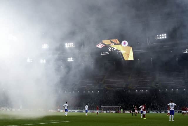 Rangers take on Spartak Moscow at the Otkritie Arena, as smoke from fireworks descends on the pitch. Picture: Getty Images