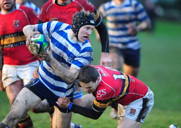 Rugby players can almost halve the force transferred to their head during an impact and reduce the risk of concussion by wearing protective headgear, a study has found.