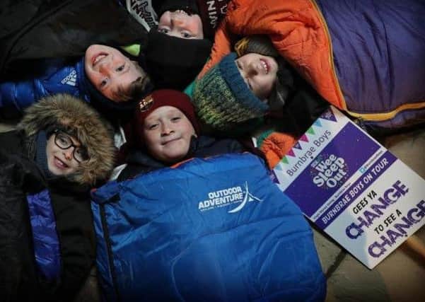 Nine year old friends Robert Hodge, Cole Hood, Ollie Willis, Cosmo MacDougall and Lachlan Johnson get themselves ready for The Wee Sleep Out in the garden in Bonnyrigg. Picture: PA