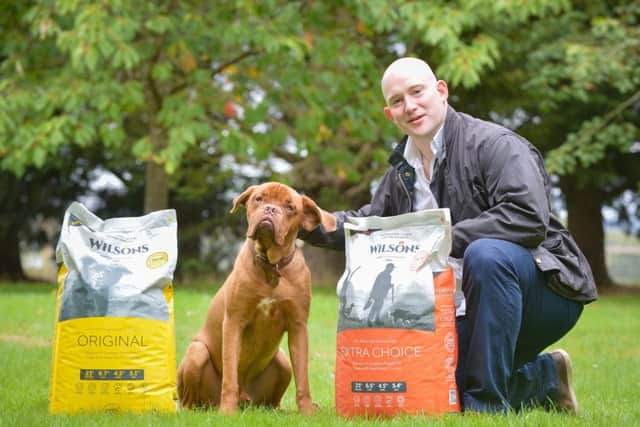 Craig Wallace of Wilsons Pet Food in Perthshire with puppy Bruce. Photo by Julie Howden