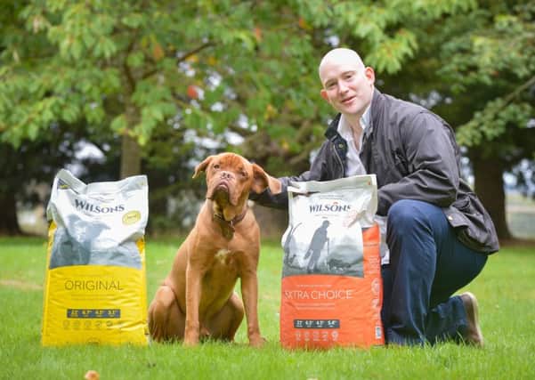 Craig Wallace of Wilsons Pet Food in Perthshire with puppy Bruce. Photo by Julie Howden