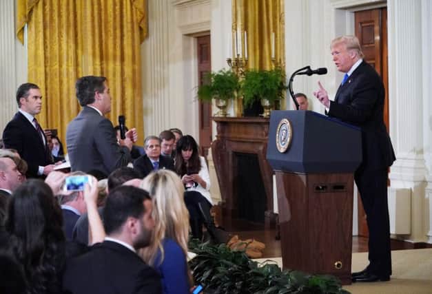 President Donald Trump gets into a heated exchange with CNN chief White House correspondent Jim Acosta. (Photo by MANDEL NGAN / AFP)