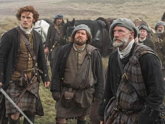 The Fraser clan's tartan are dark in colour to reflect the dirty environment the characters live in