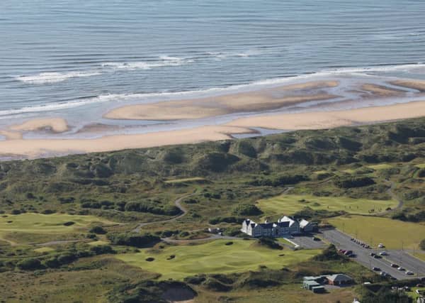 Trump International wants to build 500 houses plus holiday homes, an equestrian centre, shops and restaurants by its golf course at Menie, Aberdeenshire (pictured). PIC: Cabro Aviation/Creative Commons.