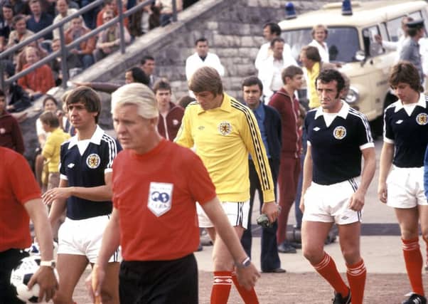 David Stewart (yellow jersey) alongside Scotland team-mates Don Masson, Danny McGrain and Willie Donachie ahead of the match against East Germany in East Berlin in 1977. Picture: SNS