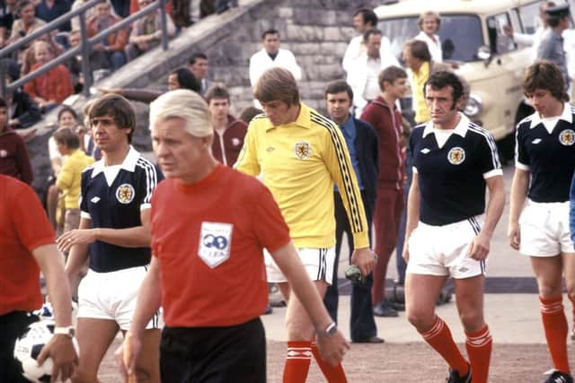David Stewart (yellow jersey) alongside Scotland team-mates Don Masson, Danny McGrain and Willie Donachie ahead of the match against East Germany in East Berlin in 1977. Picture: SNS