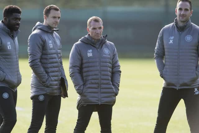 Celtic's coaching staff look on as players are put through their paces at Lennoxtown. Picture: SNS Group