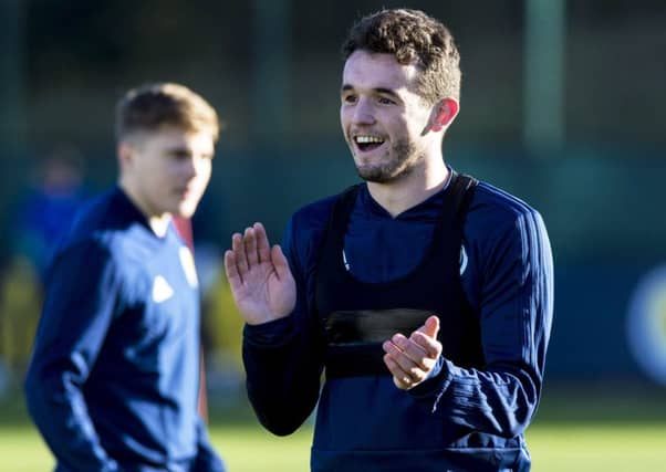 John McGinn was all smiles in training at the Oriam but may miss the games against Albania and Israel. Picture: SNS Group