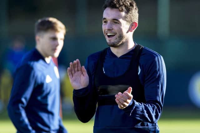 John McGinn was all smiles in training at the Oriam but may miss the games against Albania and Israel. Picture: SNS Group