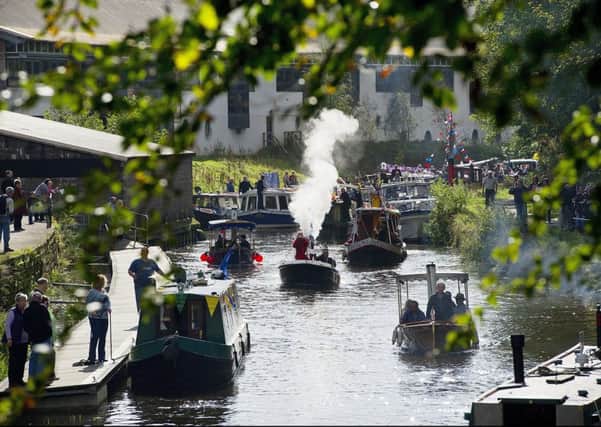 Boats of all shapes and sizes celebrate the re-opening of the Forth and Clyde Canal at Kirkintilloch. Photograph: Peter Sandground