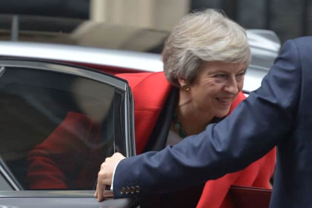 Prime Minister Theresa May returning to 10 Downing Street. Picture: PA Wire