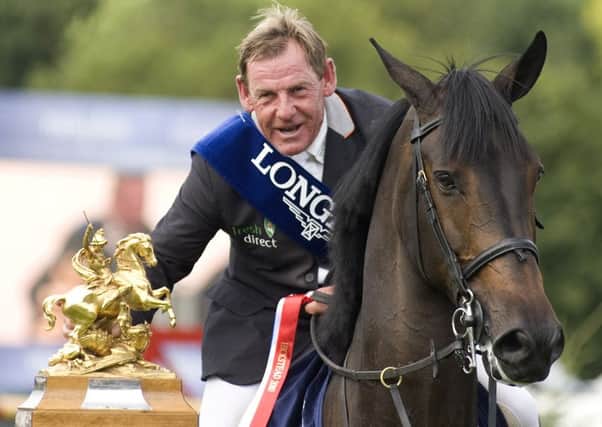 HICKSTEAD, ENGLAND - AUGUST 01: Tim Stockdale of Great Britain riding Fresh Direct Kalico Bay win The Longines King George V Gold Cup during The Longines Royal International Horse Show at Hickstead showground on August 01, 2010 in Hickstead, England. (Photo by Alan Crowhurst/ Getty Images)