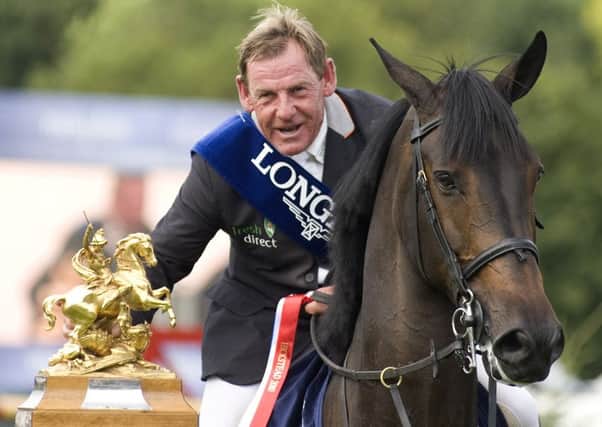HICKSTEAD, ENGLAND - AUGUST 01: Tim Stockdale of Great Britain riding Fresh Direct Kalico Bay win   The Longines King George V Gold Cup during The Longines Royal International Horse Show at Hickstead showground on August 01, 2010 in Hickstead, England.  (Photo by Alan Crowhurst/ Getty Images)