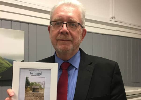 Argyll and Bute MSP Michael Russell has twinned his office toilet with one in a remote Malawi village.