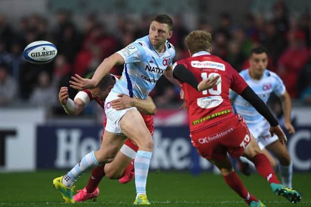 Finn Russell offloads while playing for Racing in the Champions Cup against Scarlets. Picture: Stu Forster/Getty Images