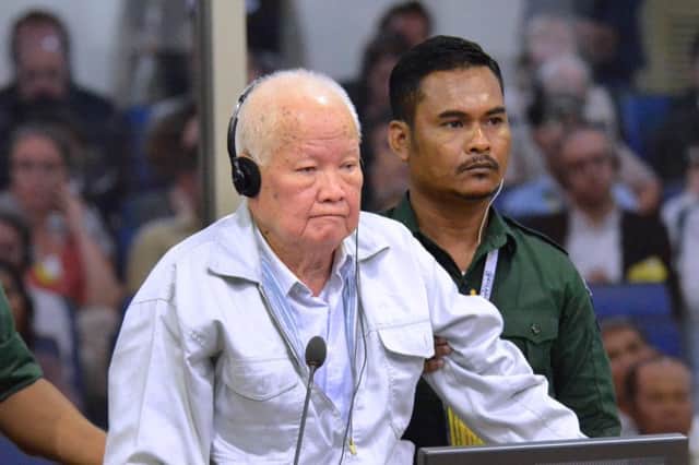 Former Khmer Rouge leader head of state Khieu Samphan stands during his verdict in court at the ECCC in Phnom Penh. Picture: (Photo by NHET SOK HENG / Extraordinary Chambers in the Courts of Cambodia / AFP)