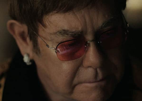 Elton John stars in the latest John Lewis ad, which recalls him coming down on Christmas morning to discover a piano (Picture: PA)