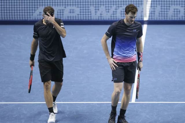 Jamie Murray and Bruno Soares look dejected in their ATP World Tour Finals doubles tennis match. Pic: AP/Tim Ireland
